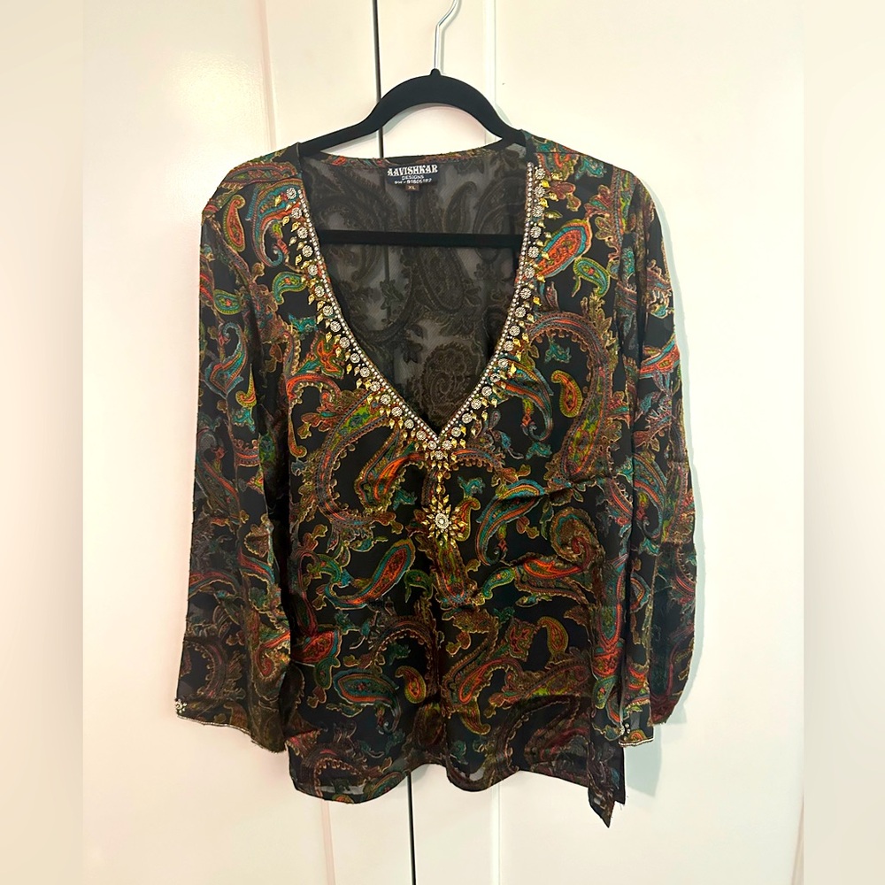 Short ornate top with embroidery. perfect for a dressy evening.